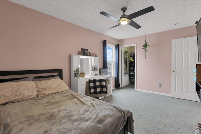 982 Margate Cir, London, OH 43140 - carpeted bedroom with baseboards, a textured ceiling, and ceiling fan