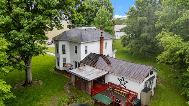 841 Township Highway 52, Nevada, OH 44849 - rear view of property featuring a lawn, a chimney, and a wooden deck