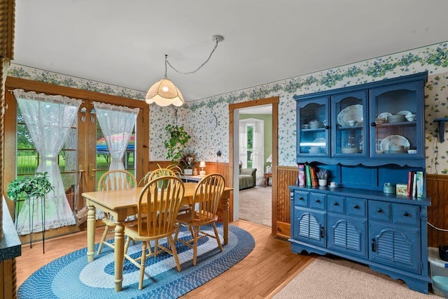 841 Township Highway 52, Nevada, OH 44849 - dining area featuring wallpapered walls, wainscoting, and light wood-style flooring