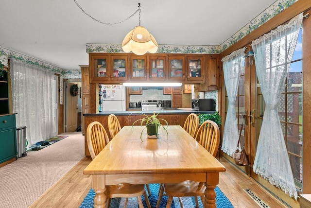 841 Township Highway 52, Nevada, OH 44849 - dining area with wallpapered walls and light wood-style flooring