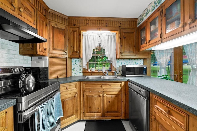 841 Township Highway 52, Nevada, OH 44849 - kitchen featuring appliances with stainless steel finishes, extractor fan, a sink, brown cabinetry, and tasteful backsplash