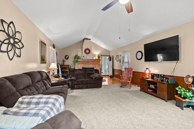 841 Township Highway 52, Nevada, OH 44849 - living room featuring carpet floors, a wainscoted wall, lofted ceiling, a ceiling fan, and wood walls