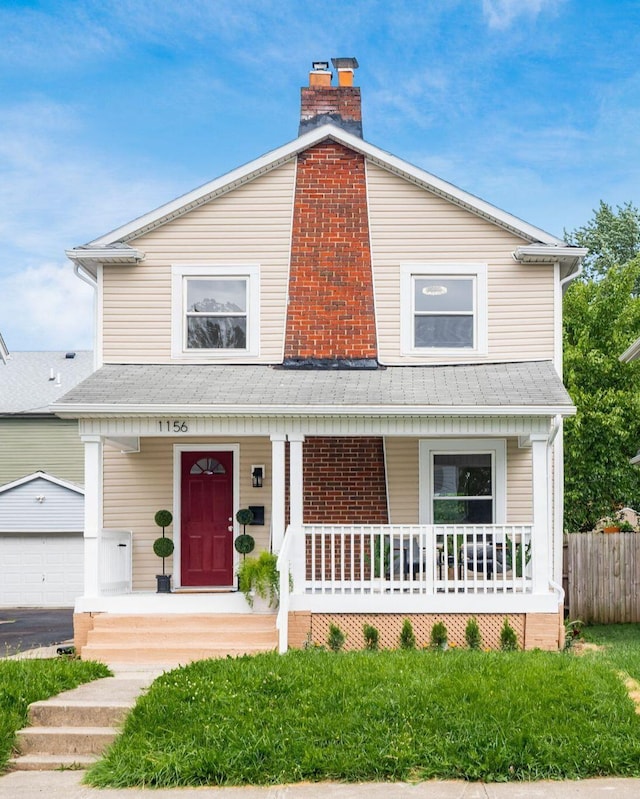 1156 S Champion Ave, Columbus, OH 43206 - view of front of property with a porch, an outdoor structure, a chimney, and roof with shingles
