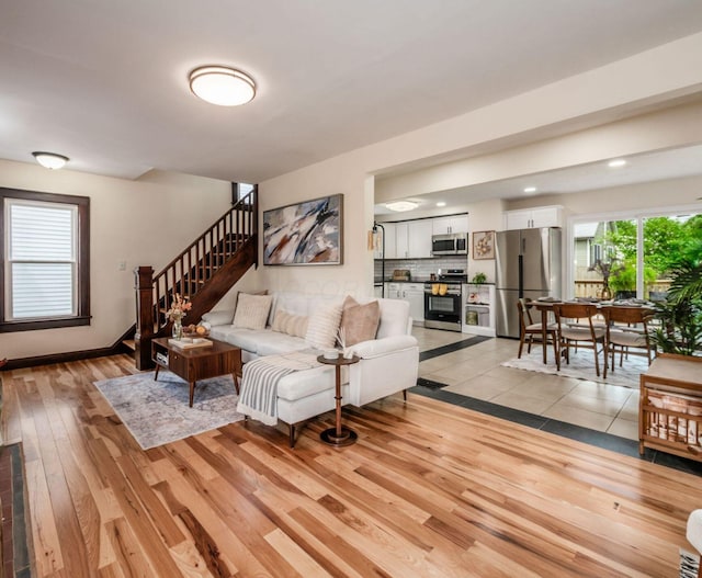 1156 S Champion Ave, Columbus, OH 43206 - living room with light wood-style floors and stairway
