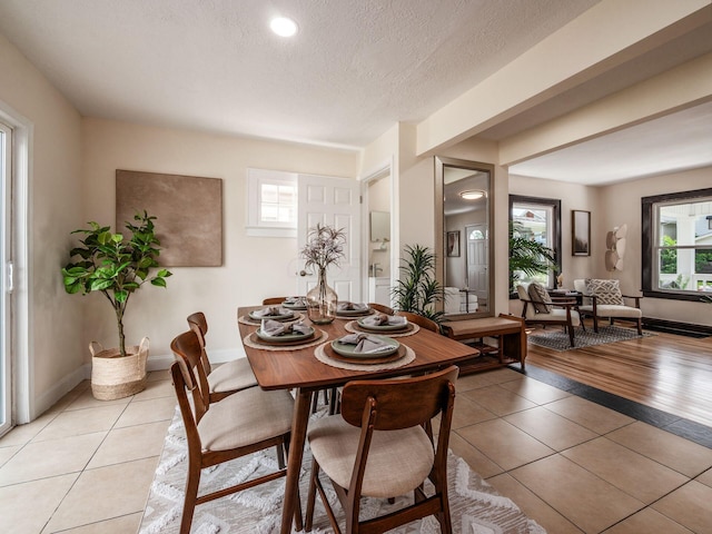 1156 S Champion Ave, Columbus, OH 43206 - dining area featuring light tile patterned floors, plenty of natural light, a textured ceiling, and recessed lighting