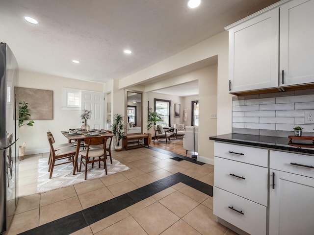 1156 S Champion Ave, Columbus, OH 43206 - dining area with recessed lighting and light tile patterned floors