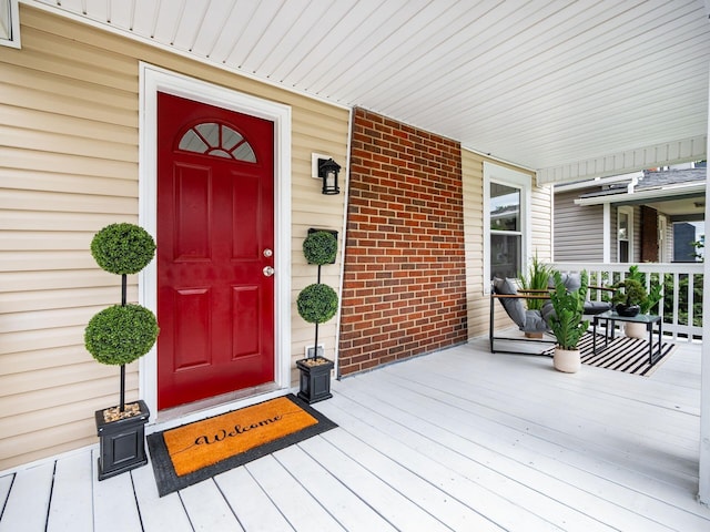 1156 S Champion Ave, Columbus, OH 43206 - view of exterior entry featuring covered porch and brick siding