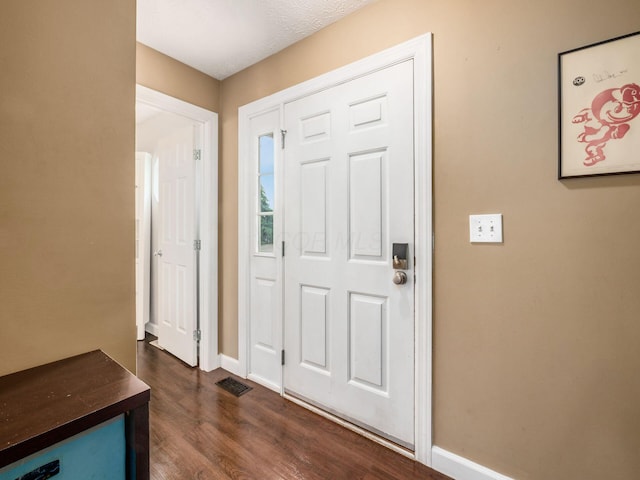 5678 Mango Ln Unit 104A, Hilliard, OH 43026 - entryway featuring dark wood-style floors and baseboards