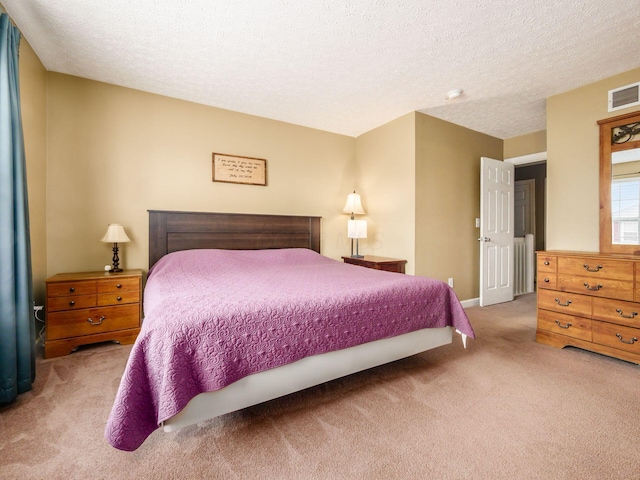 5678 Mango Ln Unit 104A, Hilliard, OH 43026 - carpeted bedroom with a textured ceiling and baseboards