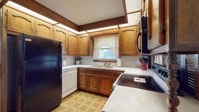 1371 Township Road 200, Bellefontaine, OH 43311 - kitchen featuring white appliances, a sink, light countertops, and brown cabinetry