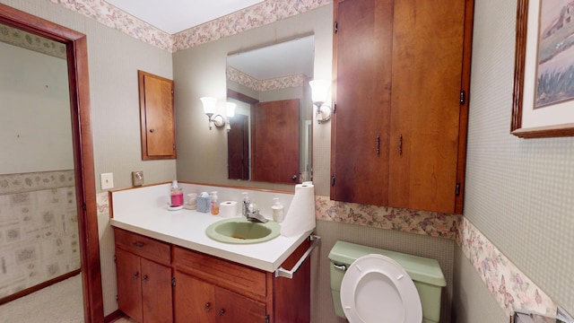 1371 Township Road 200, Bellefontaine, OH 43311 - bathroom with wallpapered walls, vanity, and toilet