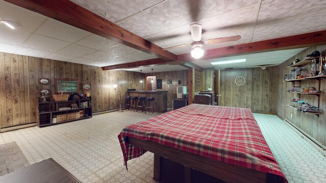 1371 Township Road 200, Bellefontaine, OH 43311 - bedroom with wooden walls, a bar, carpet floors, a baseboard radiator, and a baseboard heating unit