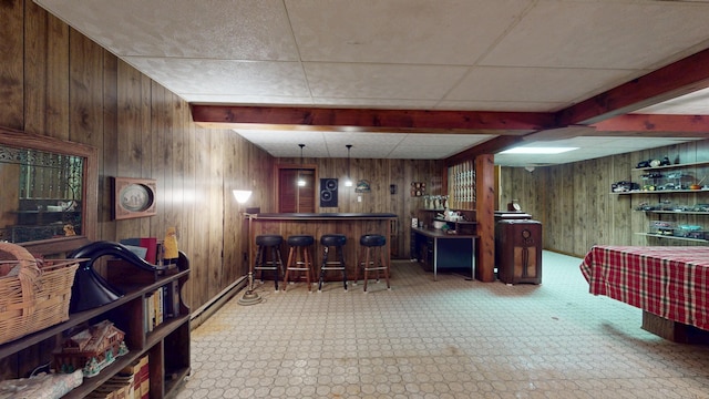 1371 Township Road 200, Bellefontaine, OH 43311 - indoor dry bar featuring wood walls, baseboard heating, and beamed ceiling