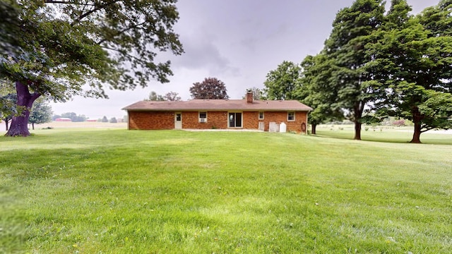 1371 Township Road 200, Bellefontaine, OH 43311 - ranch-style house with a front lawn and a chimney