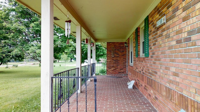 1371 Township Road 200, Bellefontaine, OH 43311 - covered porch with a lawn