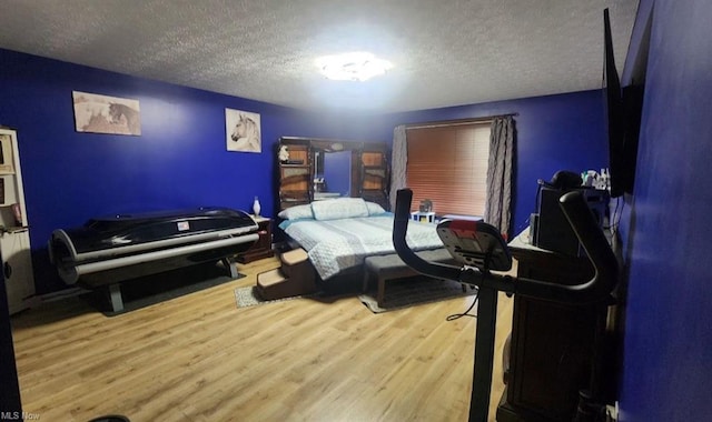 7360 Jones Rd, Nashport, OH 43830 - bedroom with a textured ceiling and wood finished floors