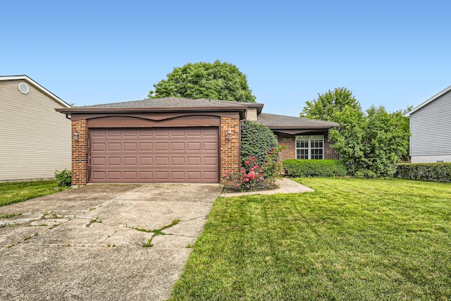 5827 Chanwick Dr, Galloway, OH 43119 - view of front of property featuring concrete driveway, brick siding, a front lawn, an attached garage, and a shingled roof