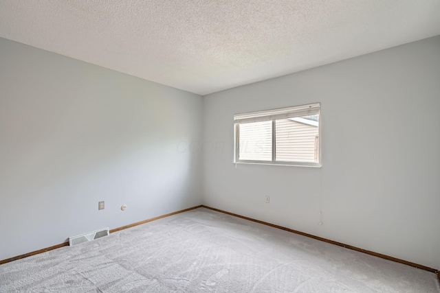 5827 Chanwick Dr, Galloway, OH 43119 - unfurnished room with light carpet, baseboards, and a textured ceiling