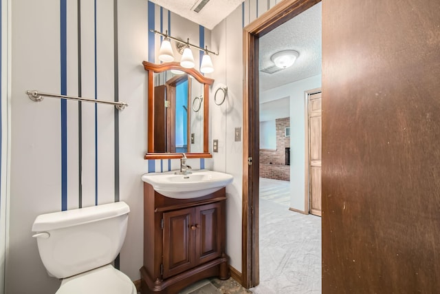 5827 Chanwick Dr, Galloway, OH 43119 - bathroom featuring toilet, a textured ceiling, and vanity
