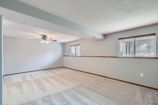 5827 Chanwick Dr, Galloway, OH 43119 - spare room with light colored carpet, a textured ceiling, ceiling fan, and baseboards
