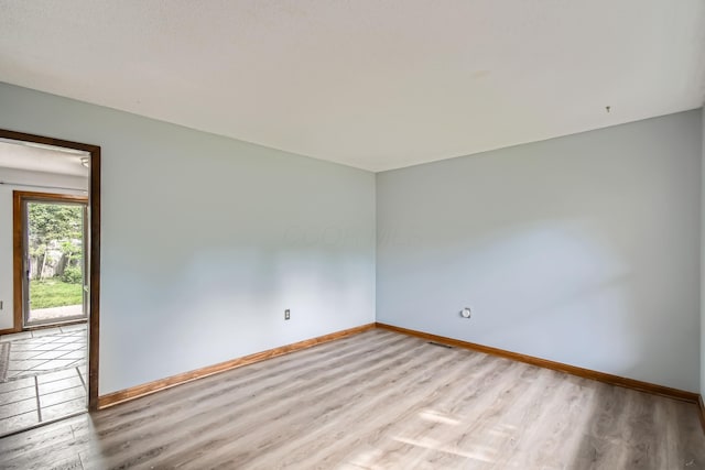 5827 Chanwick Dr, Galloway, OH 43119 - spare room featuring baseboards and wood finished floors