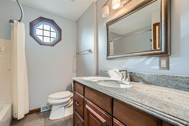 5827 Chanwick Dr, Galloway, OH 43119 - full bathroom featuring vanity, toilet, tile patterned flooring, shower / tub combo, and baseboards