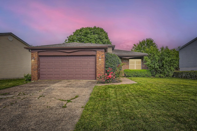 5827 Chanwick Dr, Galloway, OH 43119 - view of front facade featuring brick siding, concrete driveway, and a front yard
