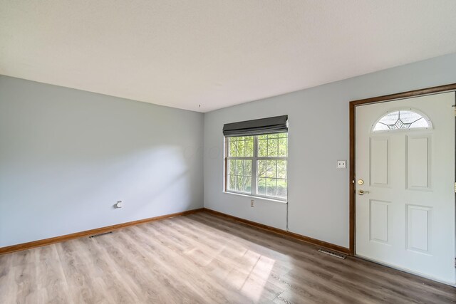 5827 Chanwick Dr, Galloway, OH 43119 - entryway featuring wood finished floors and baseboards