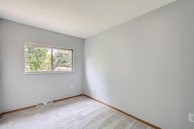 5827 Chanwick Dr, Galloway, OH 43119 - unfurnished room with light carpet, a textured ceiling, and baseboards