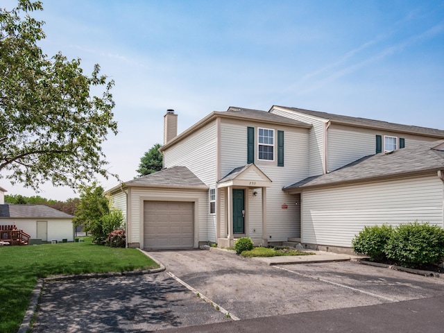 233 Malloy Ln Unit 78A, Blacklick, OH 43004 - traditional home with a chimney, an attached garage, a front yard, and driveway