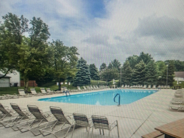 233 Malloy Ln Unit 78A, Blacklick, OH 43004 - community pool with a patio area and view of wooded area