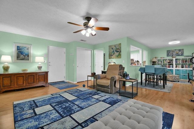 5885 Beechcroft Rd Unit 315, Columbus, OH 43229 - living area featuring ceiling fan and light wood finished floors
