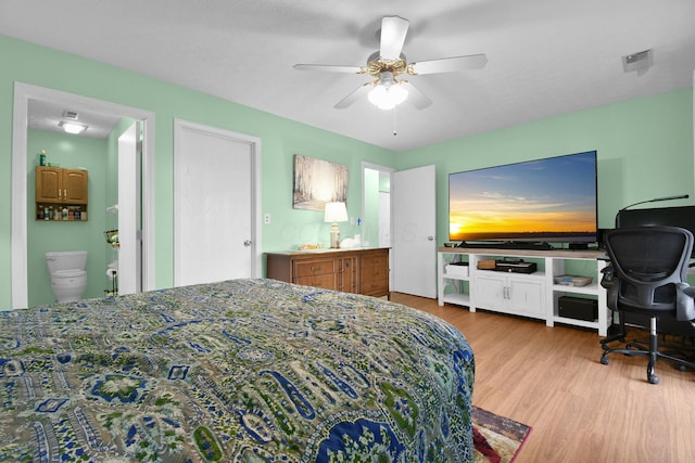 5885 Beechcroft Rd Unit 315, Columbus, OH 43229 - bedroom featuring wood finished floors, a desk, a ceiling fan, and ensuite bathroom