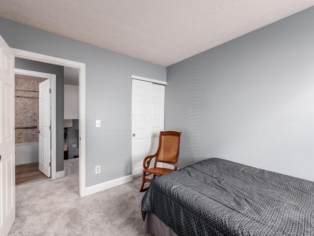 1835 Plains Blvd, Powell, OH 43065 - carpeted bedroom with a textured ceiling and a closet