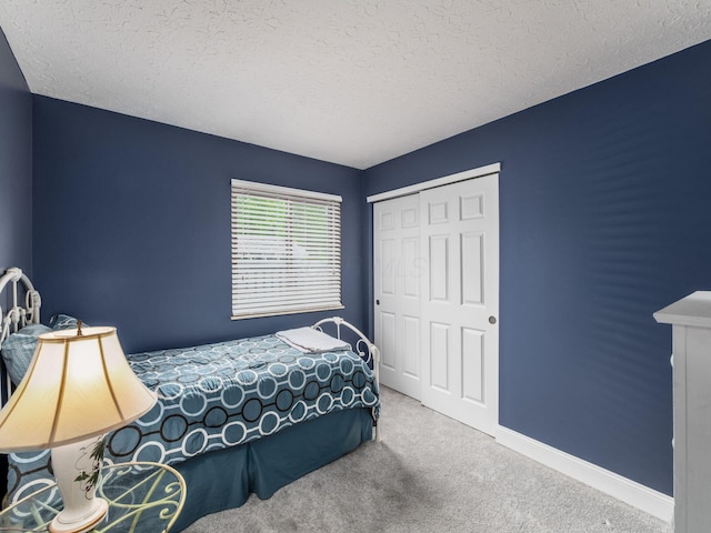 1835 Plains Blvd, Powell, OH 43065 - carpeted bedroom with a closet and a textured ceiling
