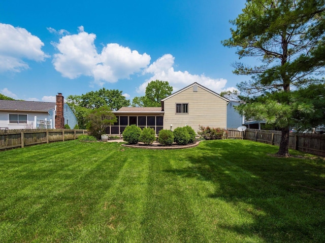 1835 Plains Blvd, Powell, OH 43065 - back of house featuring a sunroom and a fenced backyard