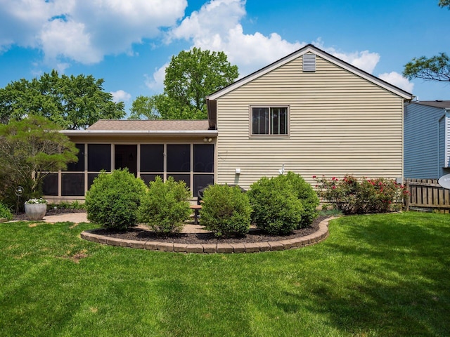 1835 Plains Blvd, Powell, OH 43065 - back of house with a sunroom, a yard, and a shingled roof