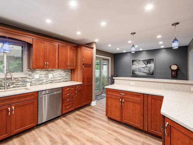 1835 Plains Blvd, Powell, OH 43065 - kitchen with stainless steel dishwasher, hanging light fixtures, brown cabinets, light wood-type flooring, and recessed lighting