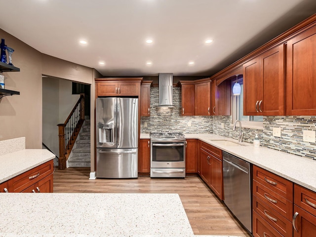 1835 Plains Blvd, Powell, OH 43065 - kitchen with stainless steel appliances, wall chimney range hood, decorative backsplash, light wood-style floors, and recessed lighting
