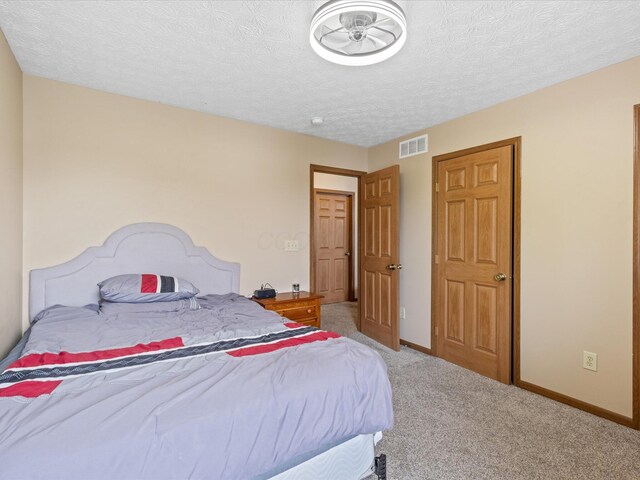 5980 Peridot St, Grove City, OH 43123 - bedroom with light colored carpet, baseboards, and a textured ceiling