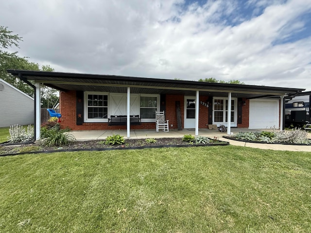 1775 Shoshoni Dr, Circleville, OH 43113 - single story home featuring covered porch, brick siding, an attached garage, and a front yard