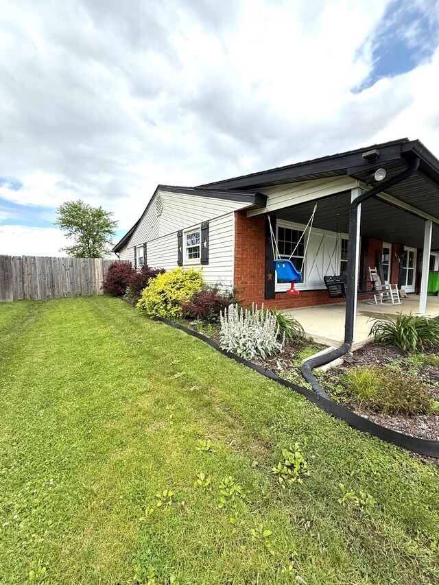 1775 Shoshoni Dr, Circleville, OH 43113 - view of home's exterior with a patio area and brick siding