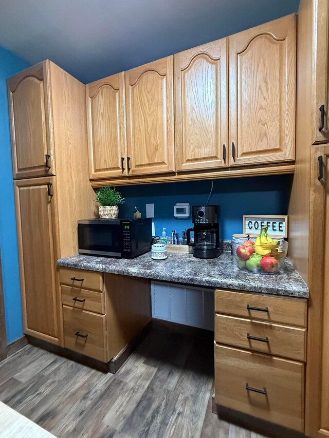 1775 Shoshoni Dr, Circleville, OH 43113 - kitchen with black microwave, wood finished floors, and light brown cabinetry