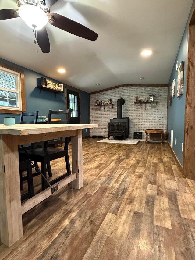 1775 Shoshoni Dr, Circleville, OH 43113 - bar featuring brick wall, lofted ceiling, a wood stove, wood finished floors, and a ceiling fan