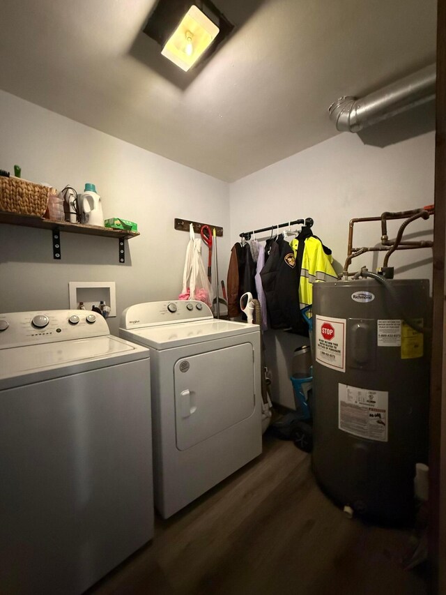 1775 Shoshoni Dr, Circleville, OH 43113 - laundry room featuring electric water heater, washing machine and dryer, and wood finished floors