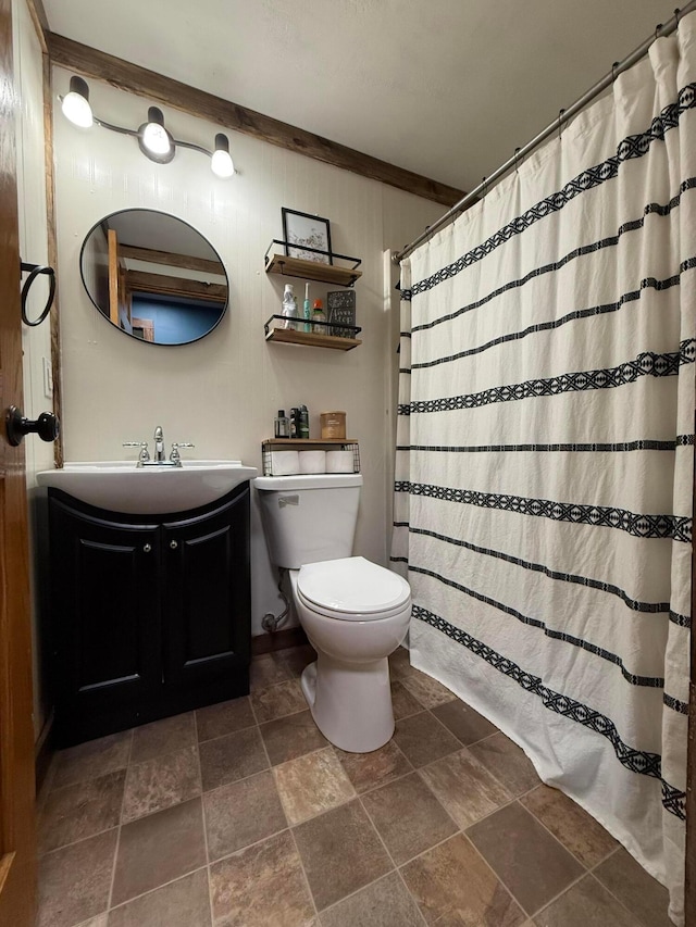 1775 Shoshoni Dr, Circleville, OH 43113 - bathroom with stone tile floors, toilet, vanity, and a shower with curtain