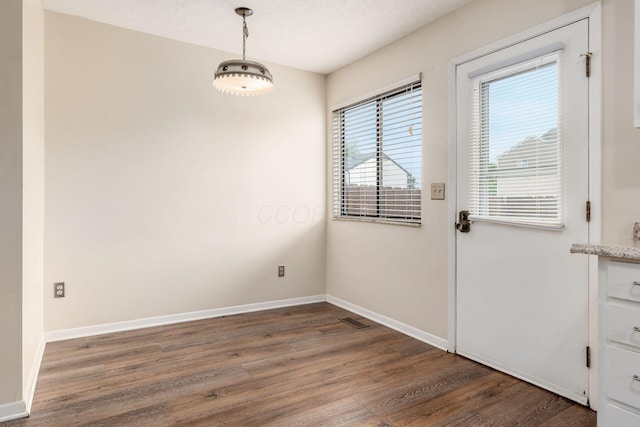 1955 Slaton Ct, Columbus, OH 43235 - unfurnished dining area featuring wood finished floors and baseboards