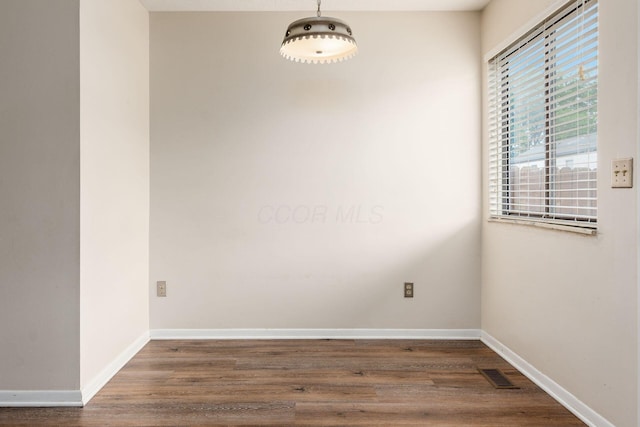 1955 Slaton Ct, Columbus, OH 43235 - empty room with dark wood-style flooring and baseboards