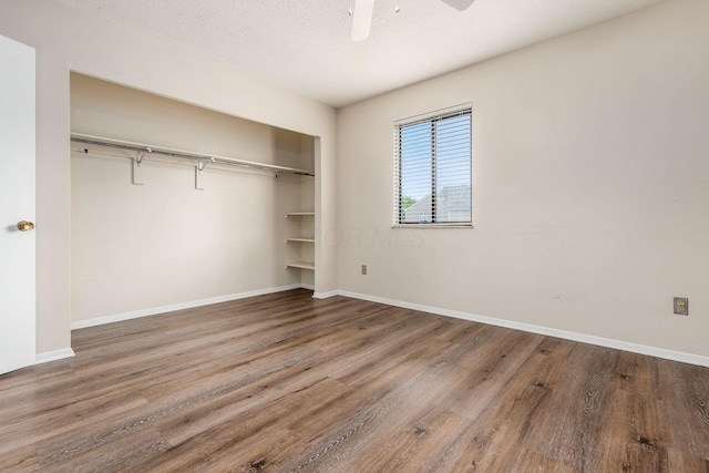 1955 Slaton Ct, Columbus, OH 43235 - unfurnished bedroom with wood finished floors, a closet, and baseboards