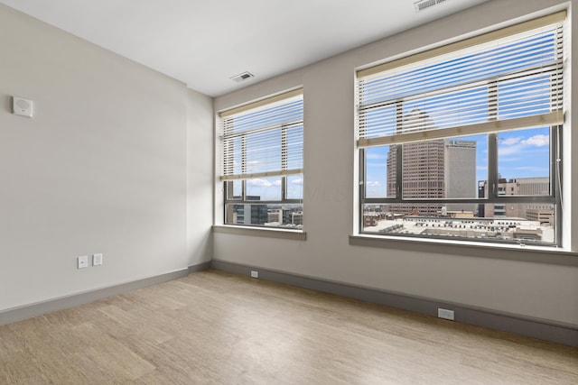 51 N High St # 806, Columbus, OH 43215 - unfurnished room with baseboards and wood finished floors